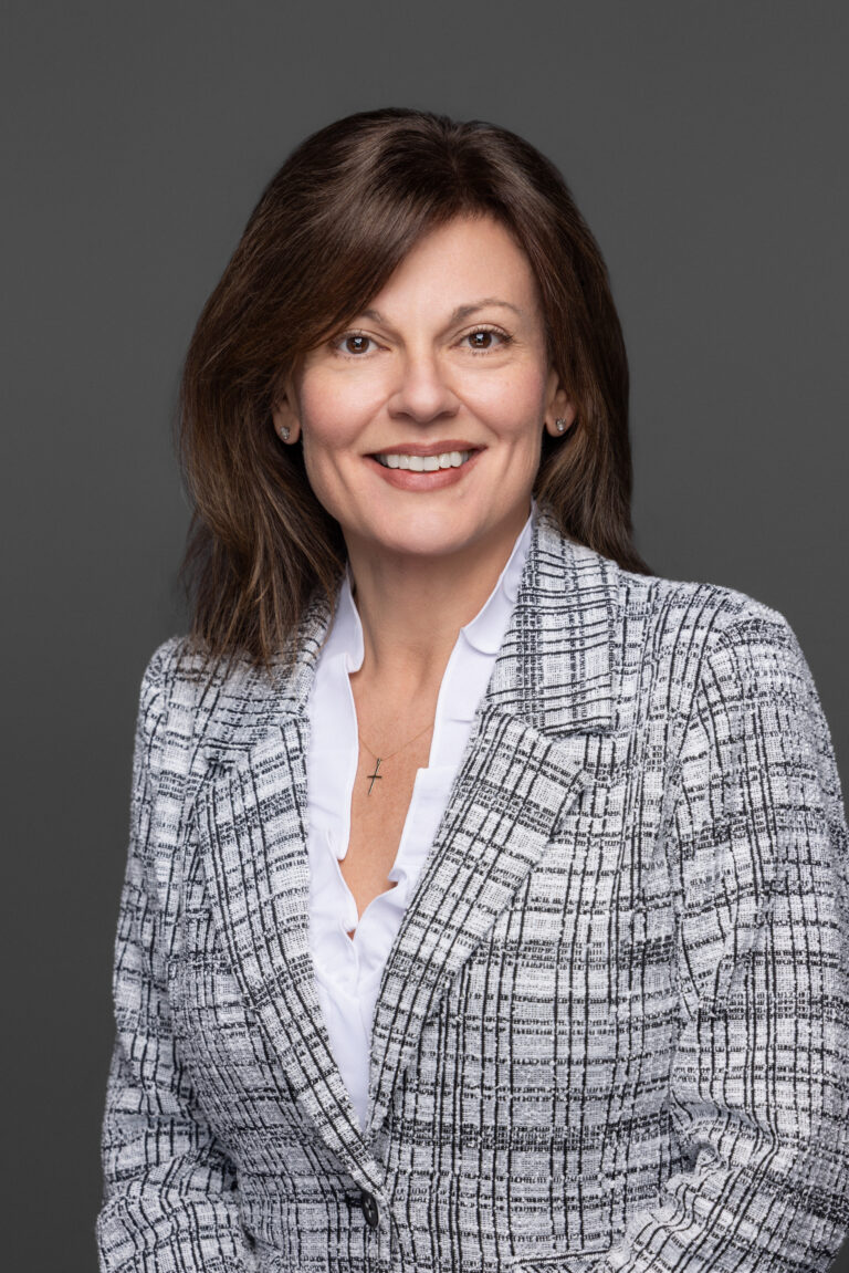 Dr T sitting, in color, B&W jacket